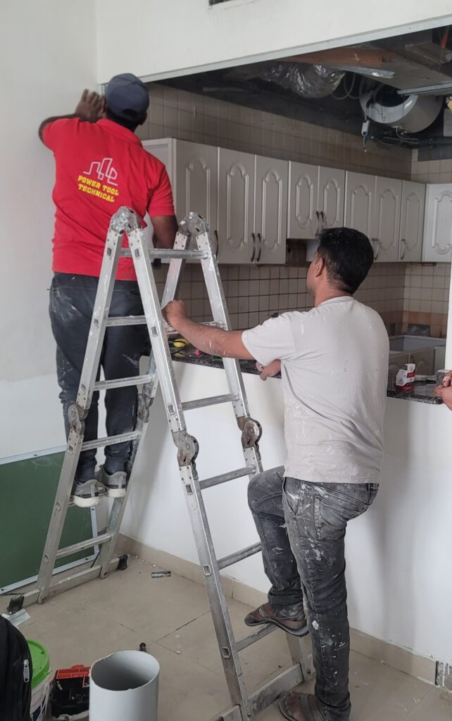 workers from www.fastfixexperts.com doing kitchen and washroom fitting work at Dubai Marina